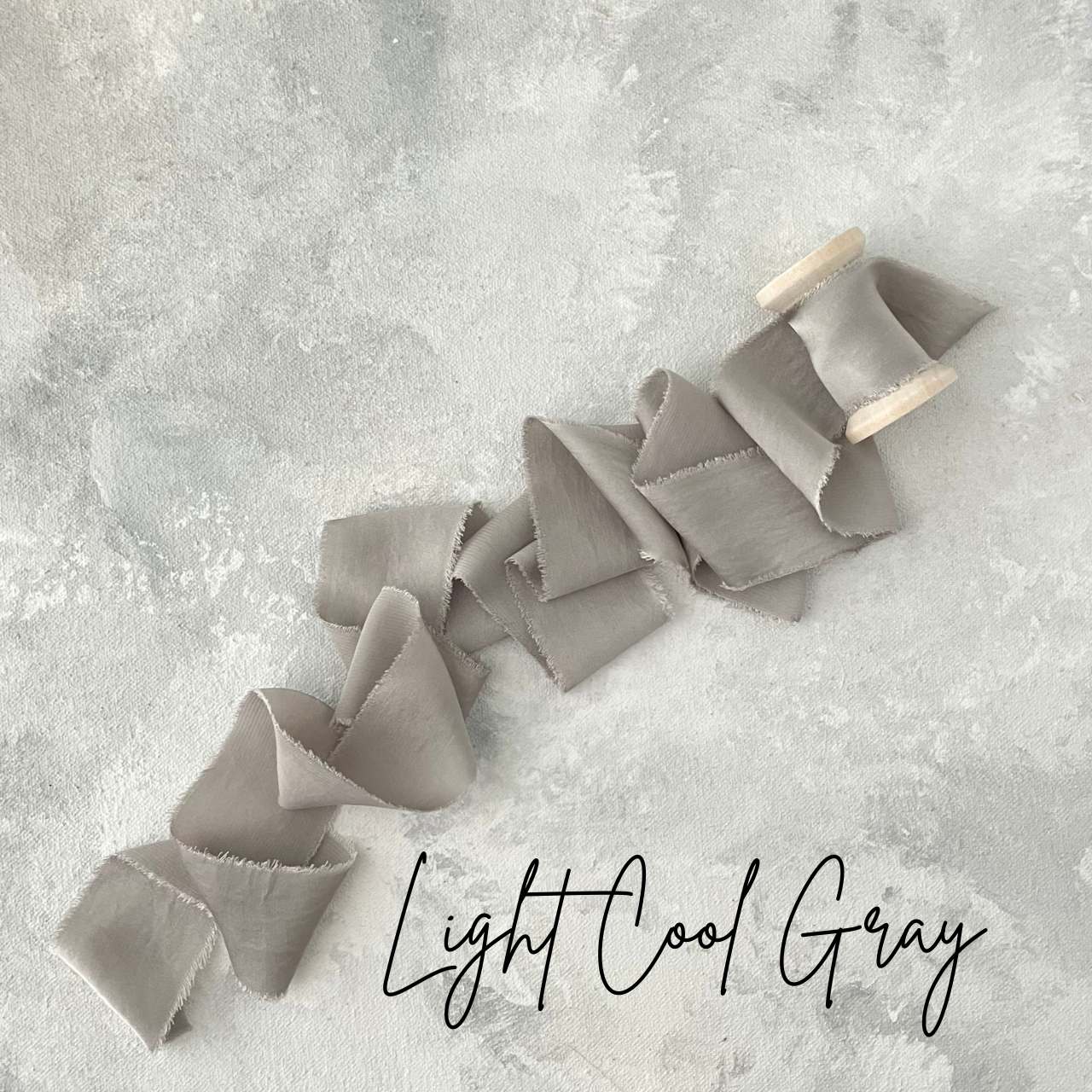 Light Gray Silk ribbon on a wood spool