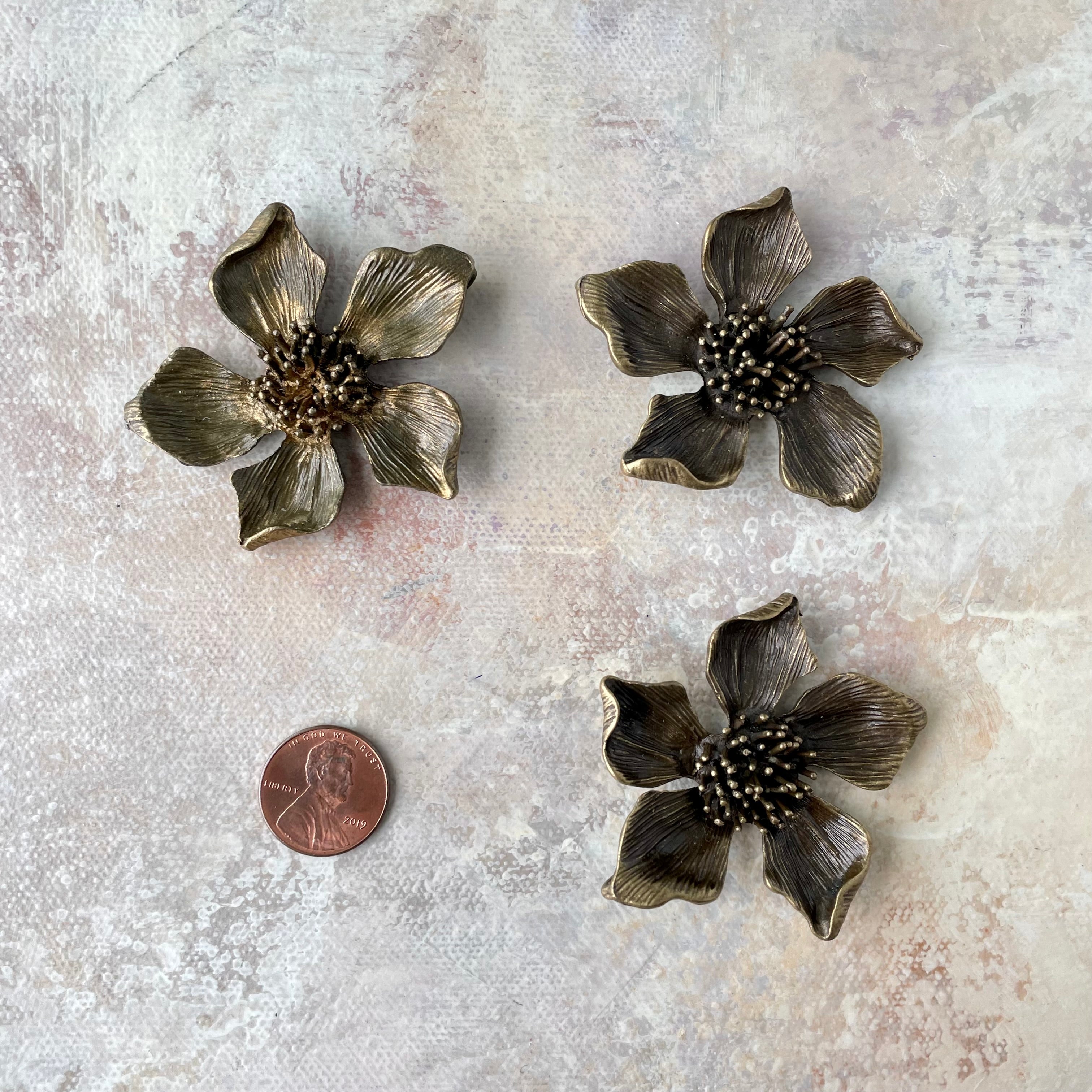 3 larger metal styling flower with penny beside for size reference - flat lay props from Champagne & GRIT