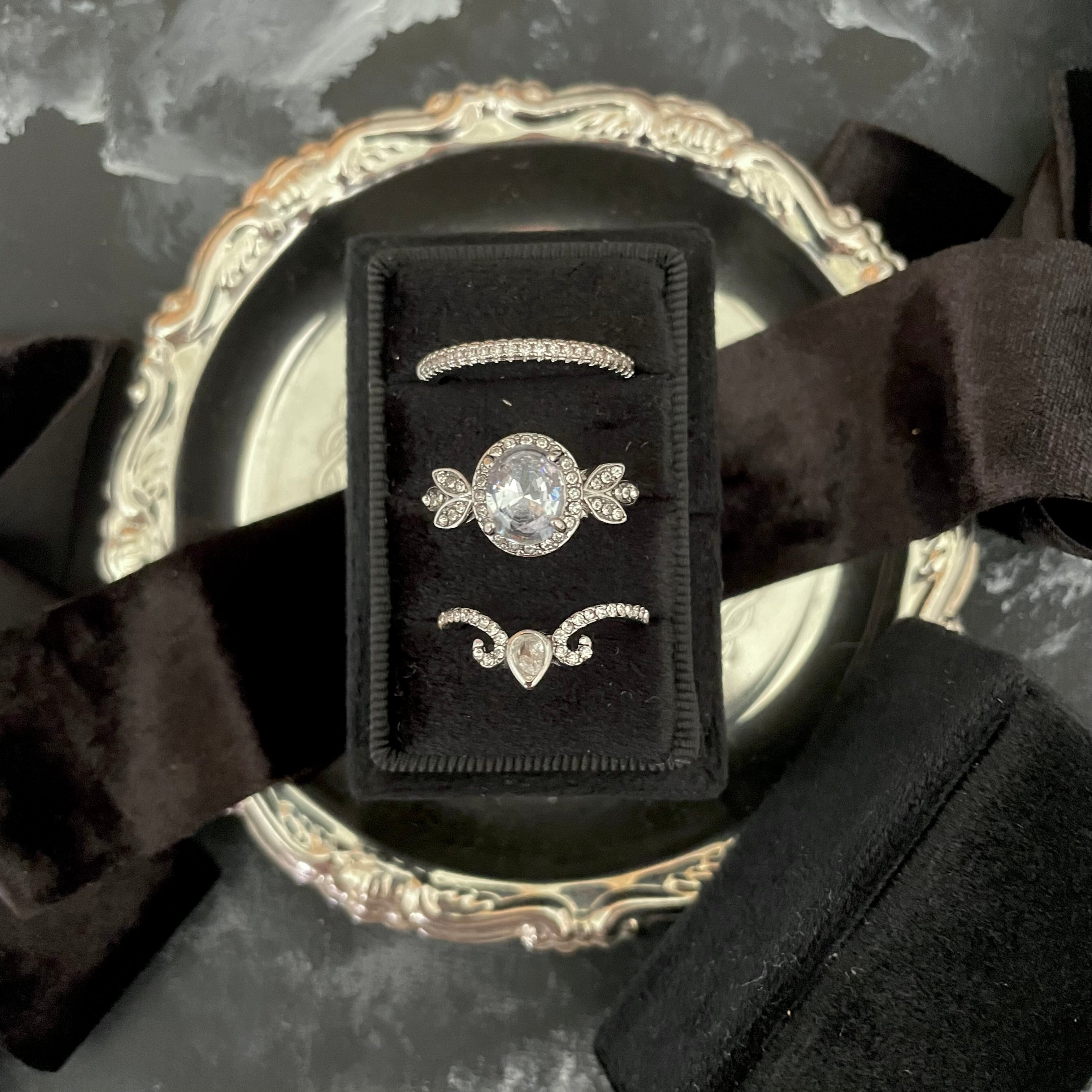 Modern black 3 slot ring box on small vintage silver dish with black ribbon  - Wedding Flat lay props from Champagne & GRIT