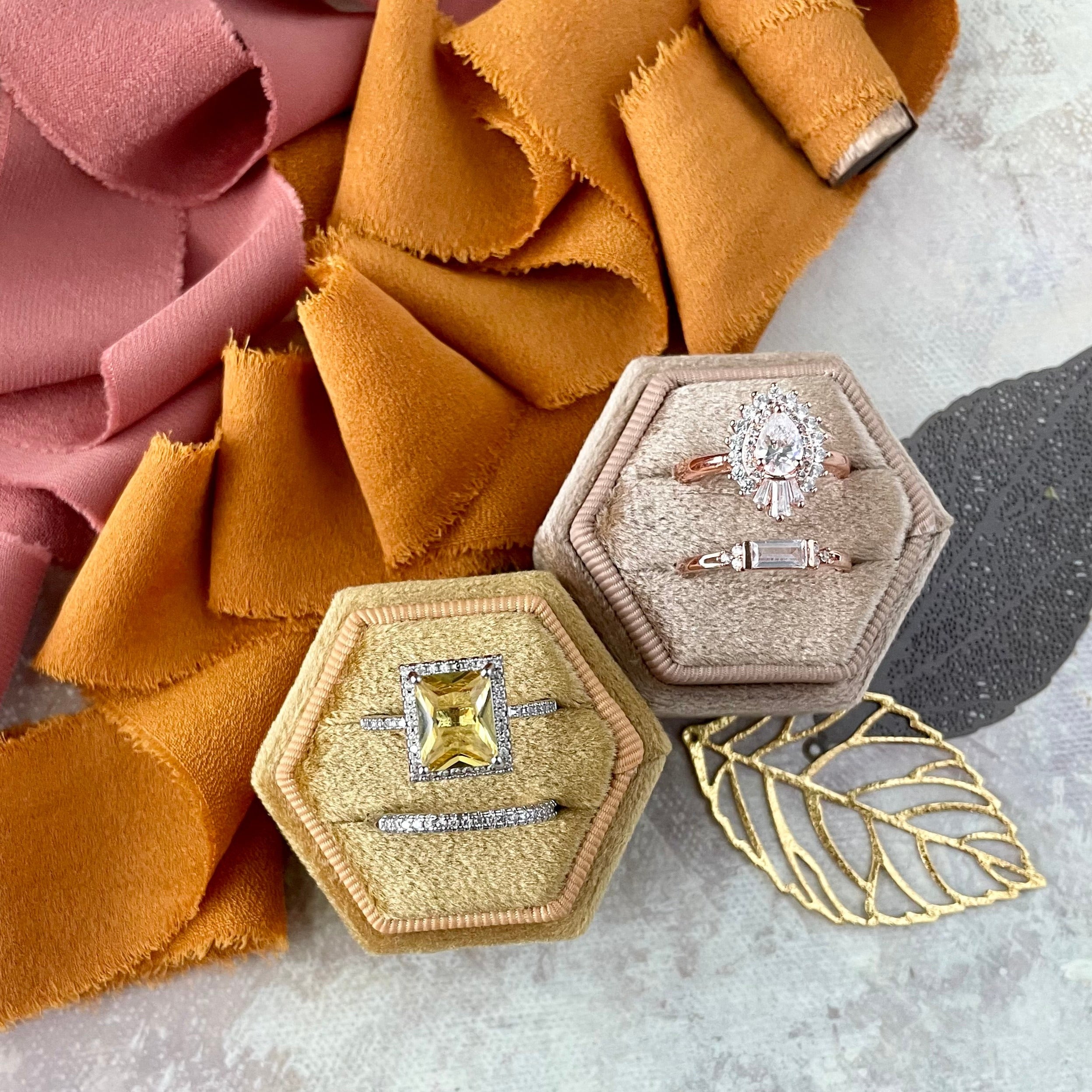 Antique gold and camel ring boxes styled with gold metal leaf and 2 spools of ribbon - Wedding Flat lay props from Champagne & GRIT