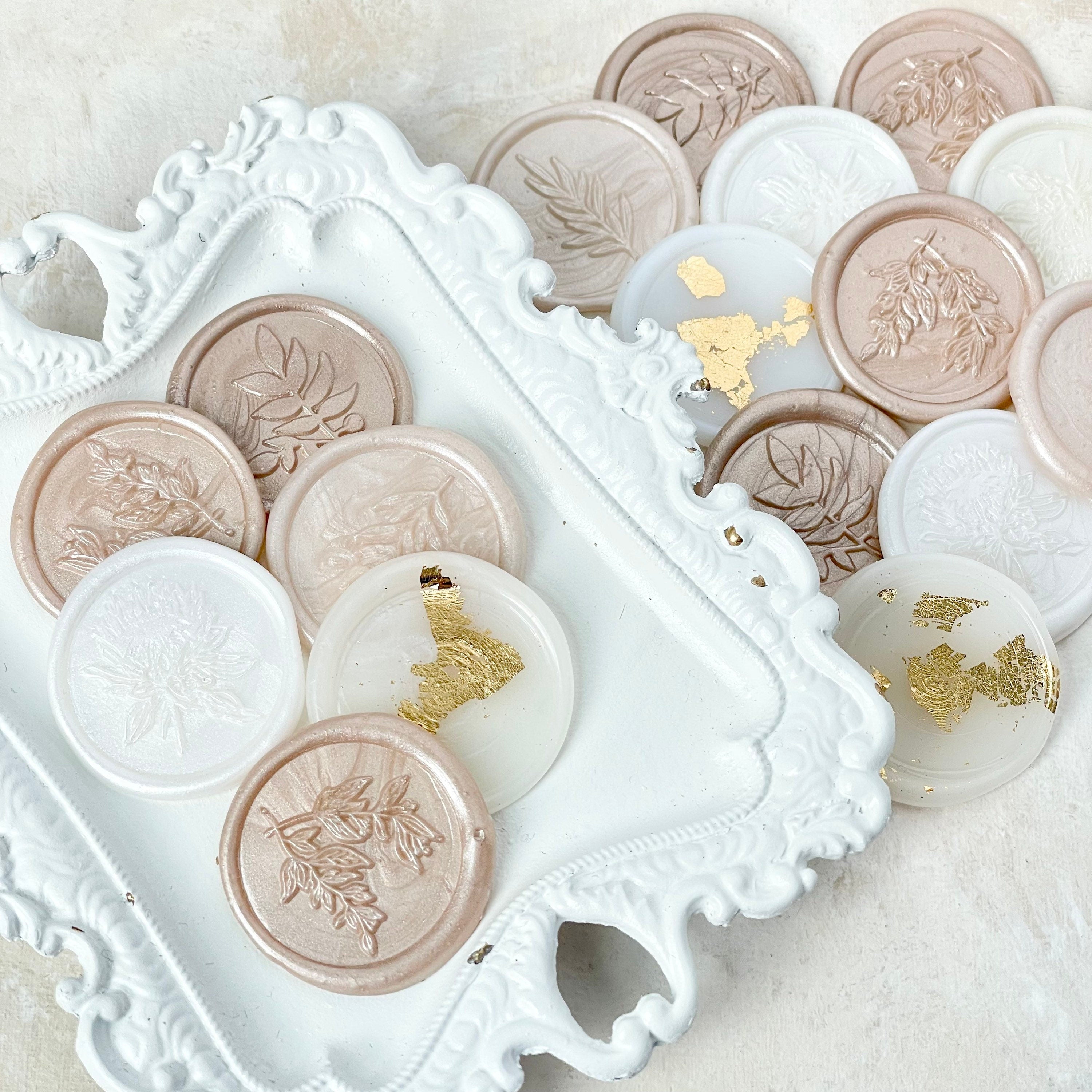 17 champagne wax seals, 6 of them on a white vintage tray - flat lay props from Champagne & GRIT
