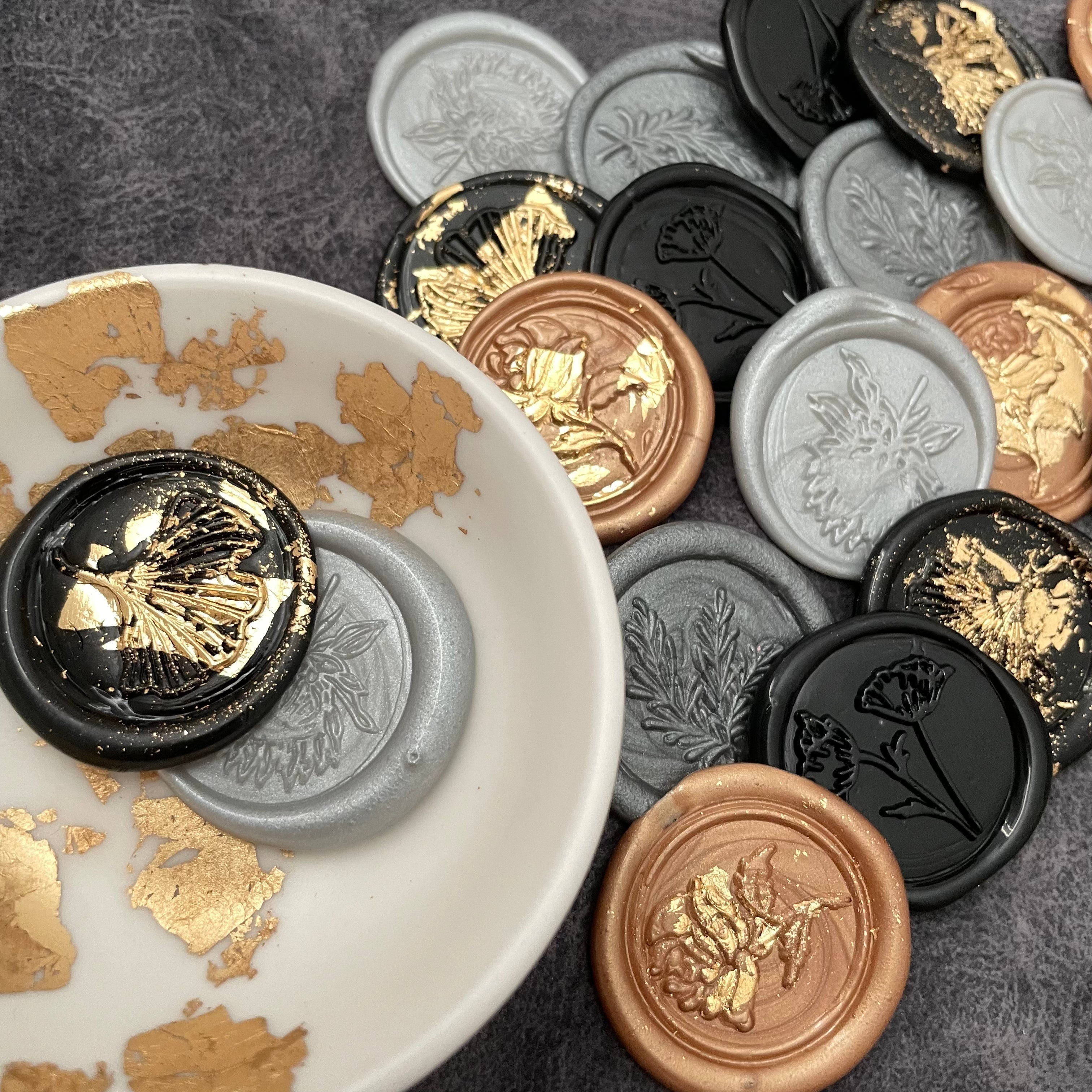 Black, gray and gold Leaf & Floral Design wax seals in white and gold vintage dish  - Wedding Flat lay props from Champagne & GRIT