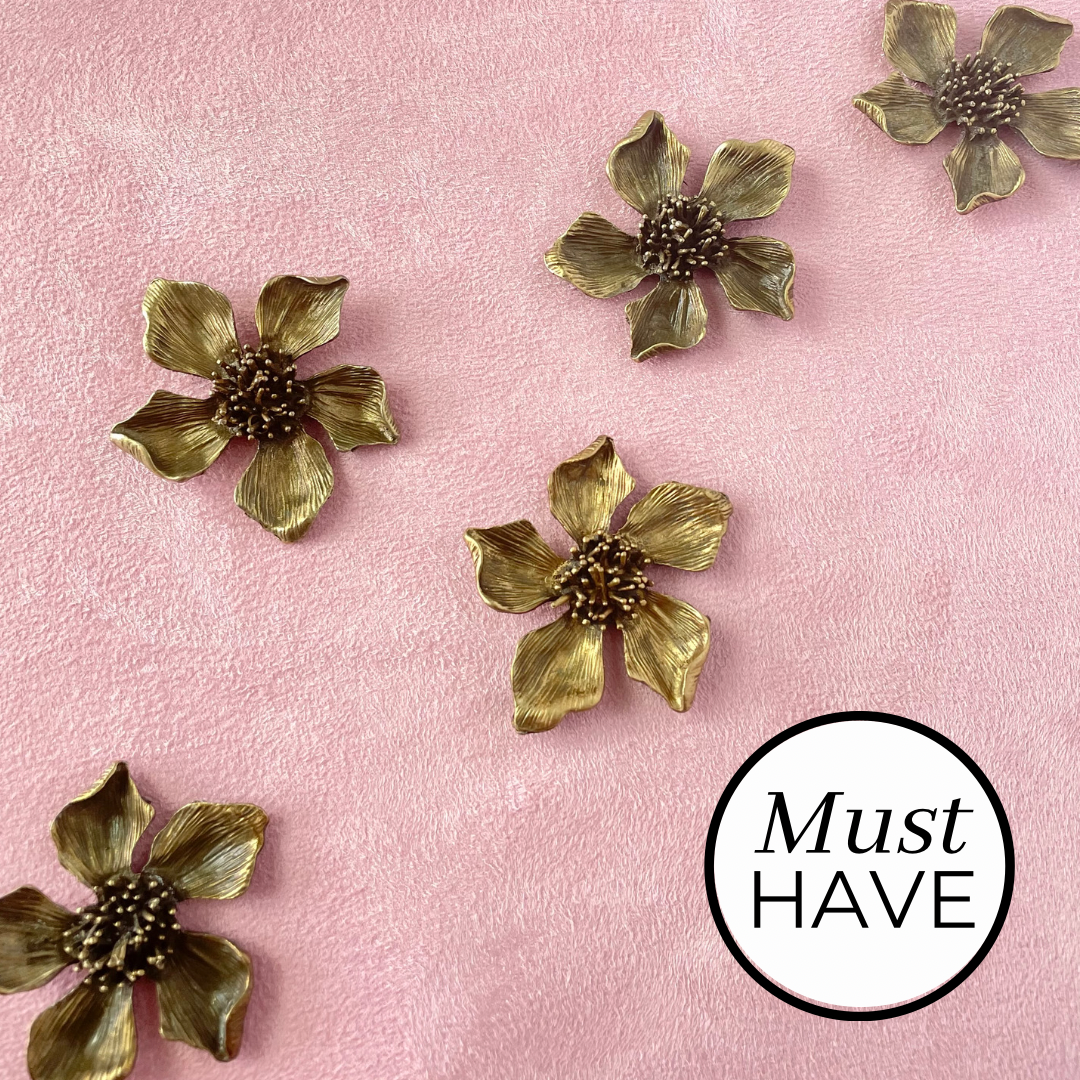 5 Metal styling flowers that have a  Brown Finish with touches of gold must have styling props from Champagne & GRIT