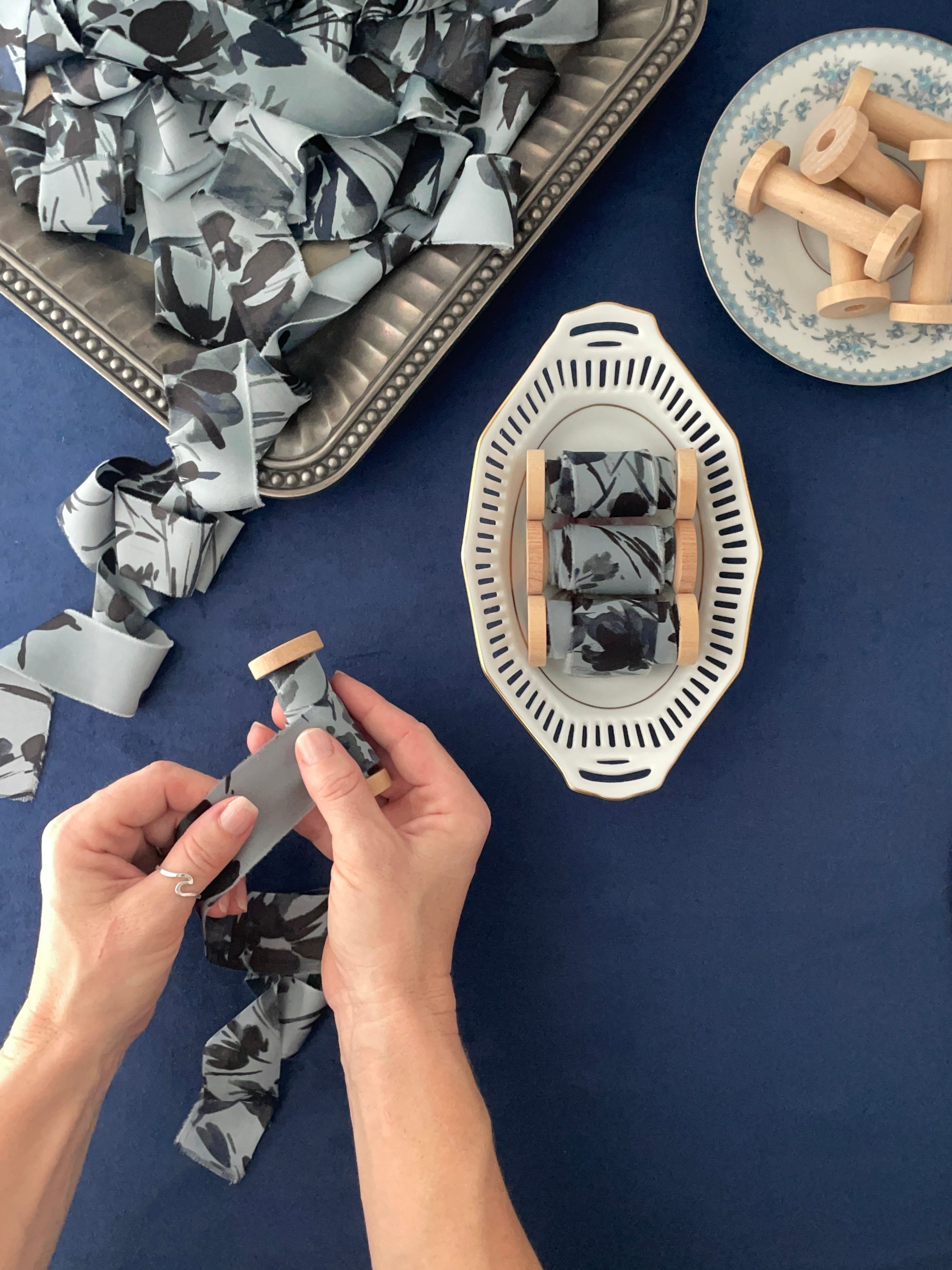 Floral dusty blue ribbon on a vintage tray from Champagne & GRIT