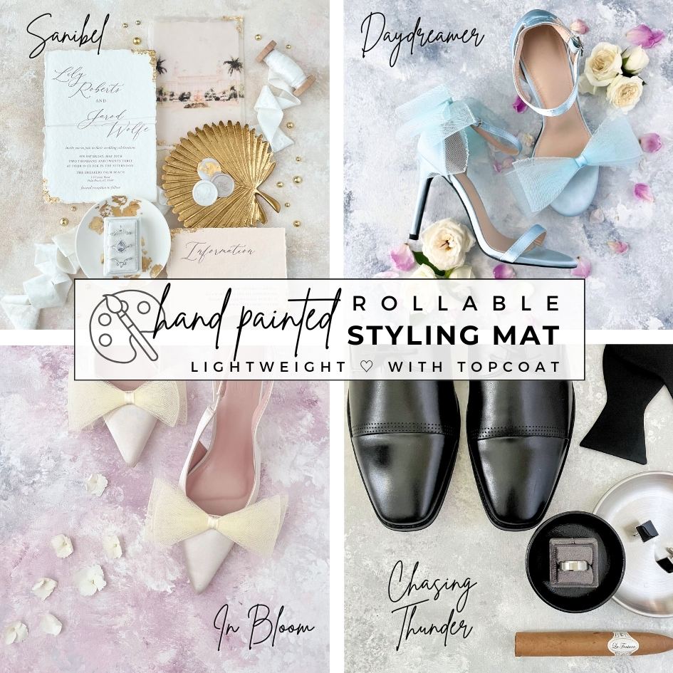 Flat lay Details of a Dusty Blue Wedding on Hand Painted FlatLay Backdrop.  There are 4 different rollable flat lay Styling mats featuring ; a Dusty Blue FlatLay Mat, A Blush Styling Surface, a Neutral Flat lay Styling Mat, a Gray FlatLay Backdrop