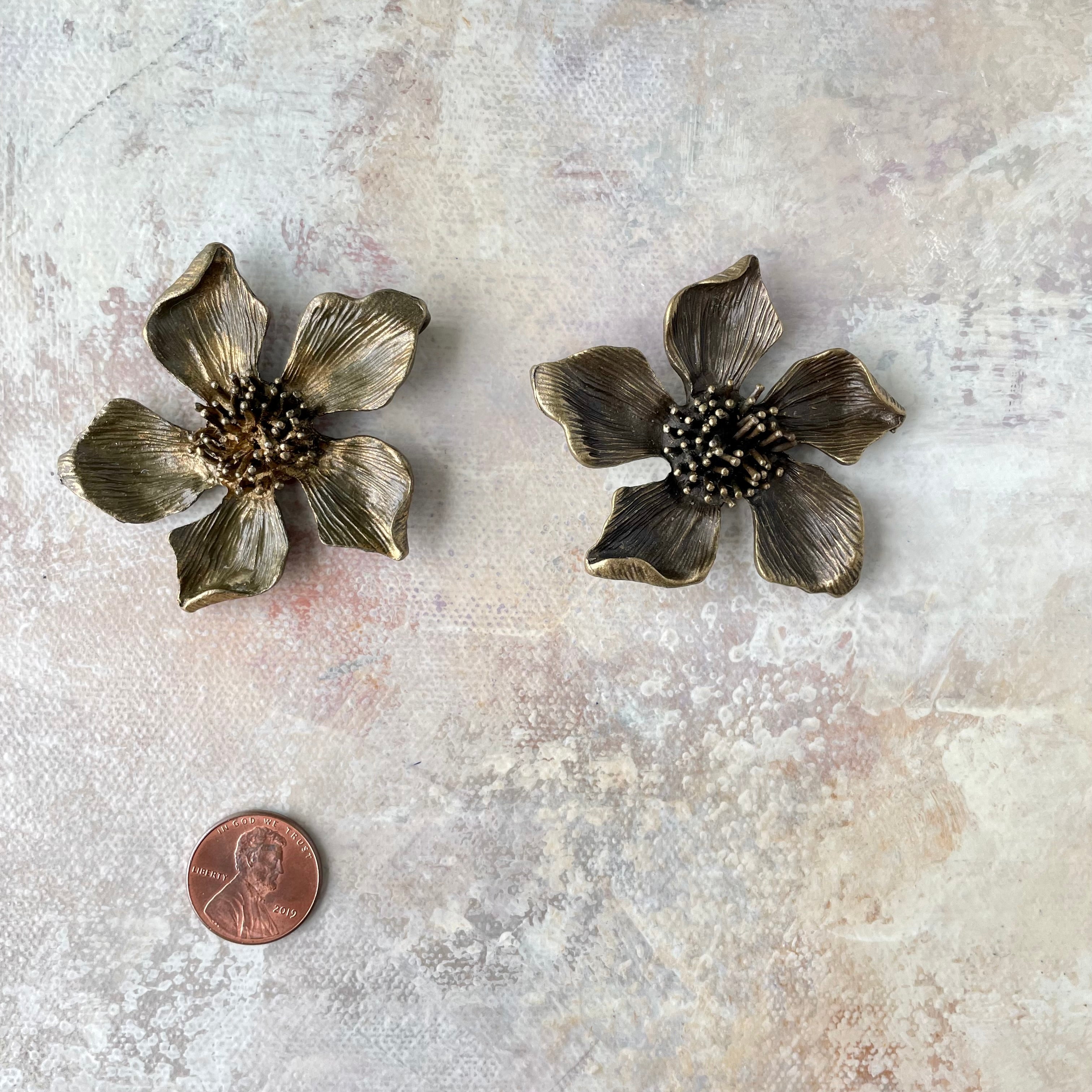2 larger metal styling flower with penny beside for size reference - flat lay props from Champagne & GRIT