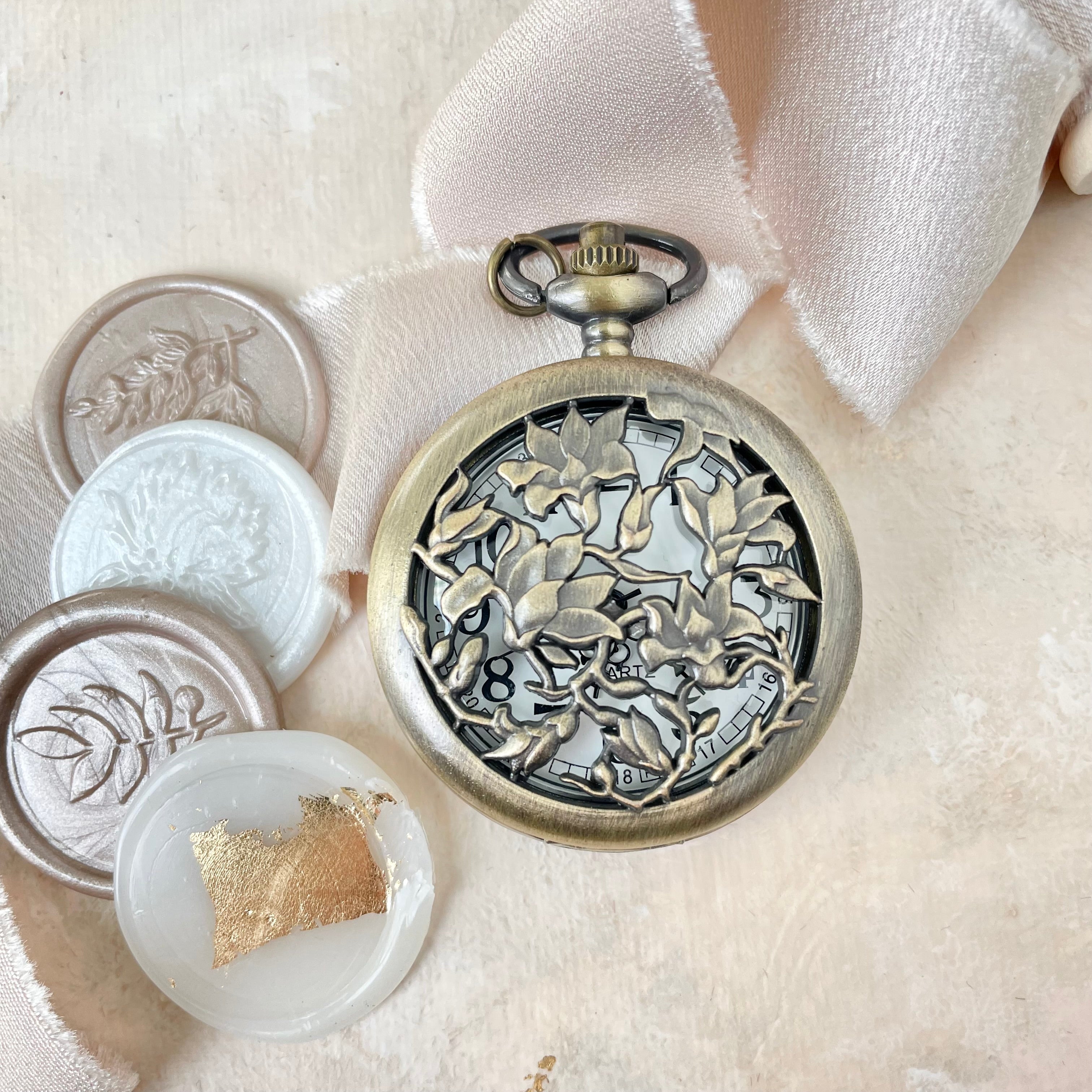 Wax seals styled with vintage pocket watch and champagne ribbon - Wedding Flat lay props from Champagne & GRIT