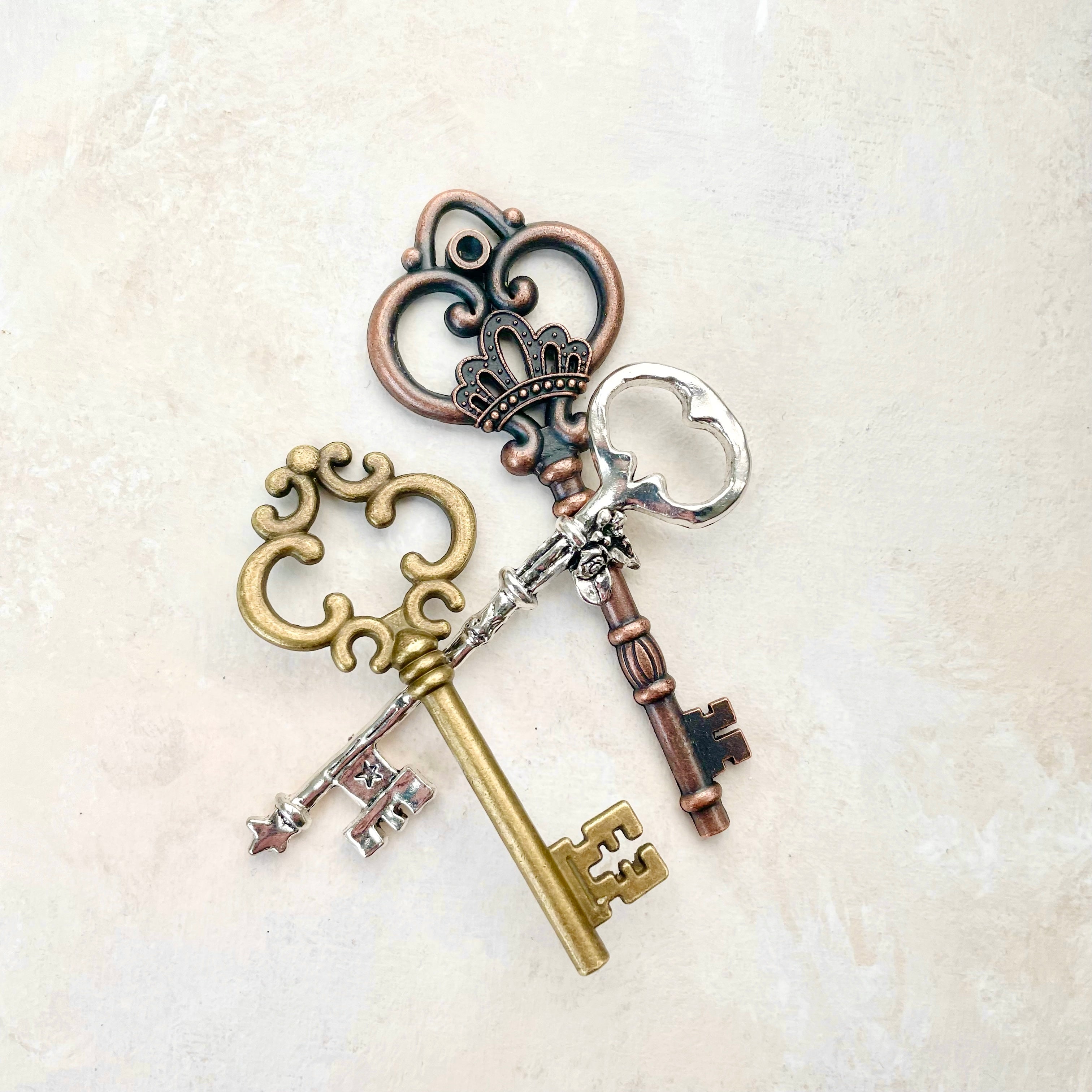 3 keys, gold, bronze and silver - must have Wedding Flat lay props from Champagne & GRIT
