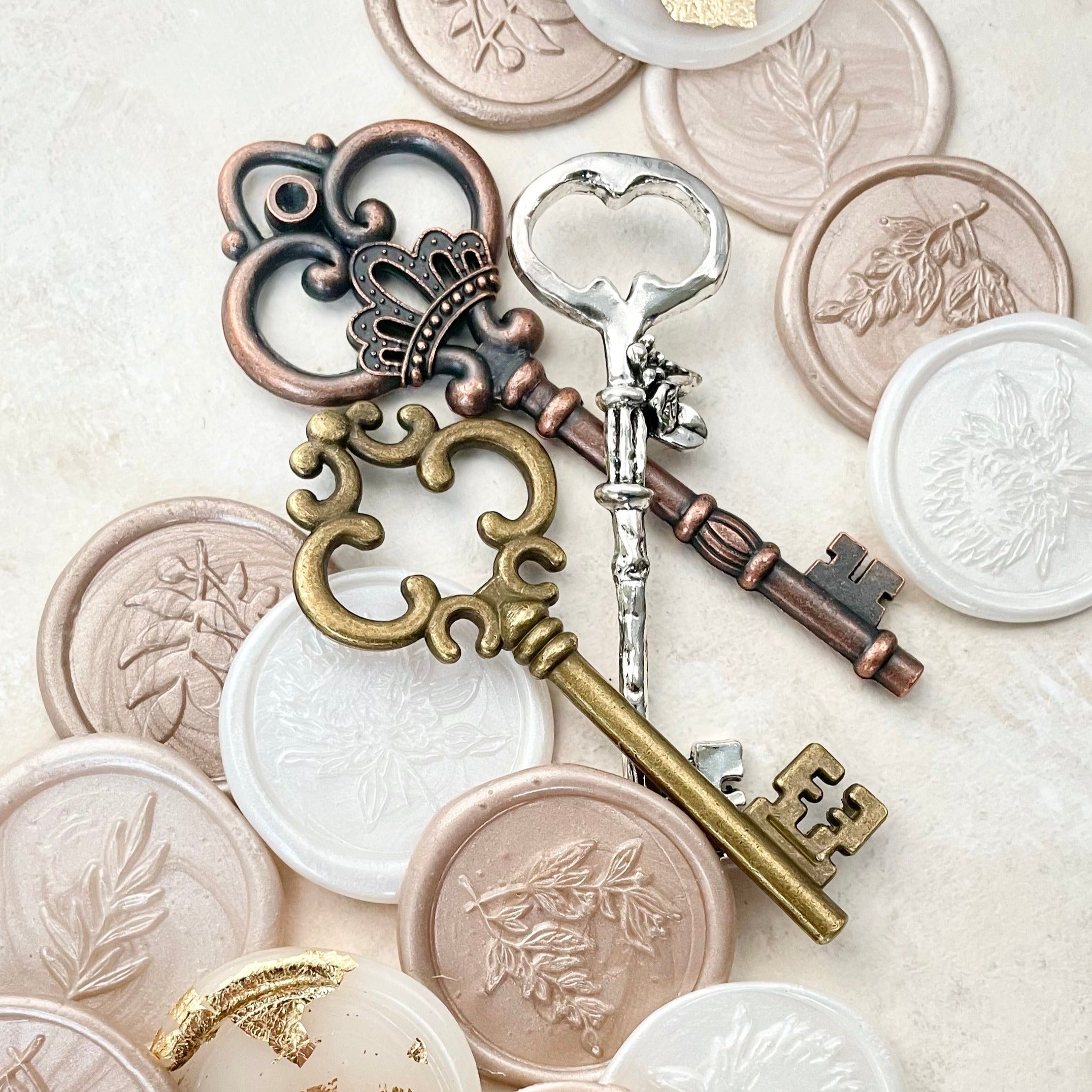 3 keys, gold, bronze and silver and 10 champagne wax seals - Wedding Flat lay props from Champagne & GRIT
