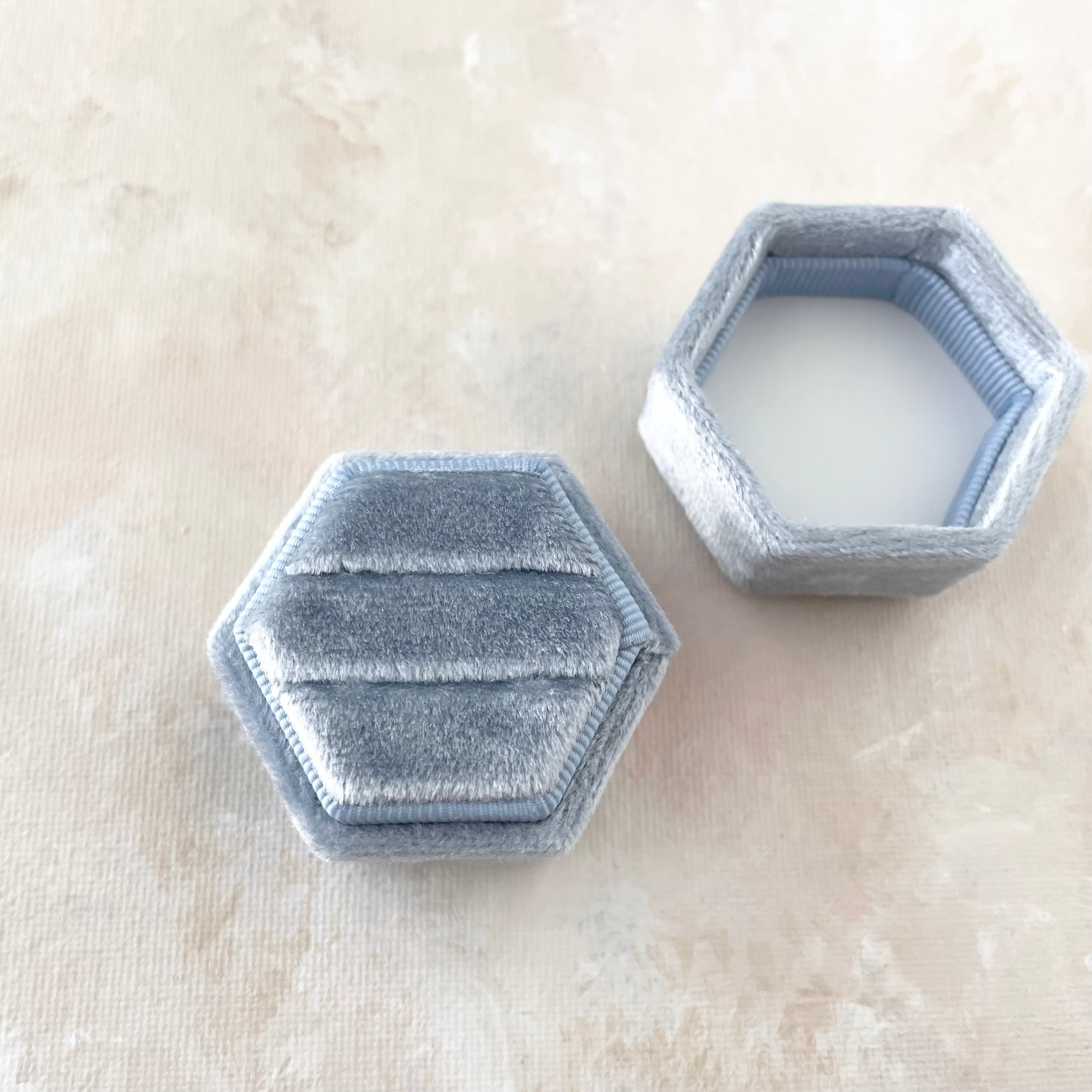 Dusty Blue Ring Box, hexagon shaped, with no rings and lid off - wedding flat lay props from Champagne & GRIT