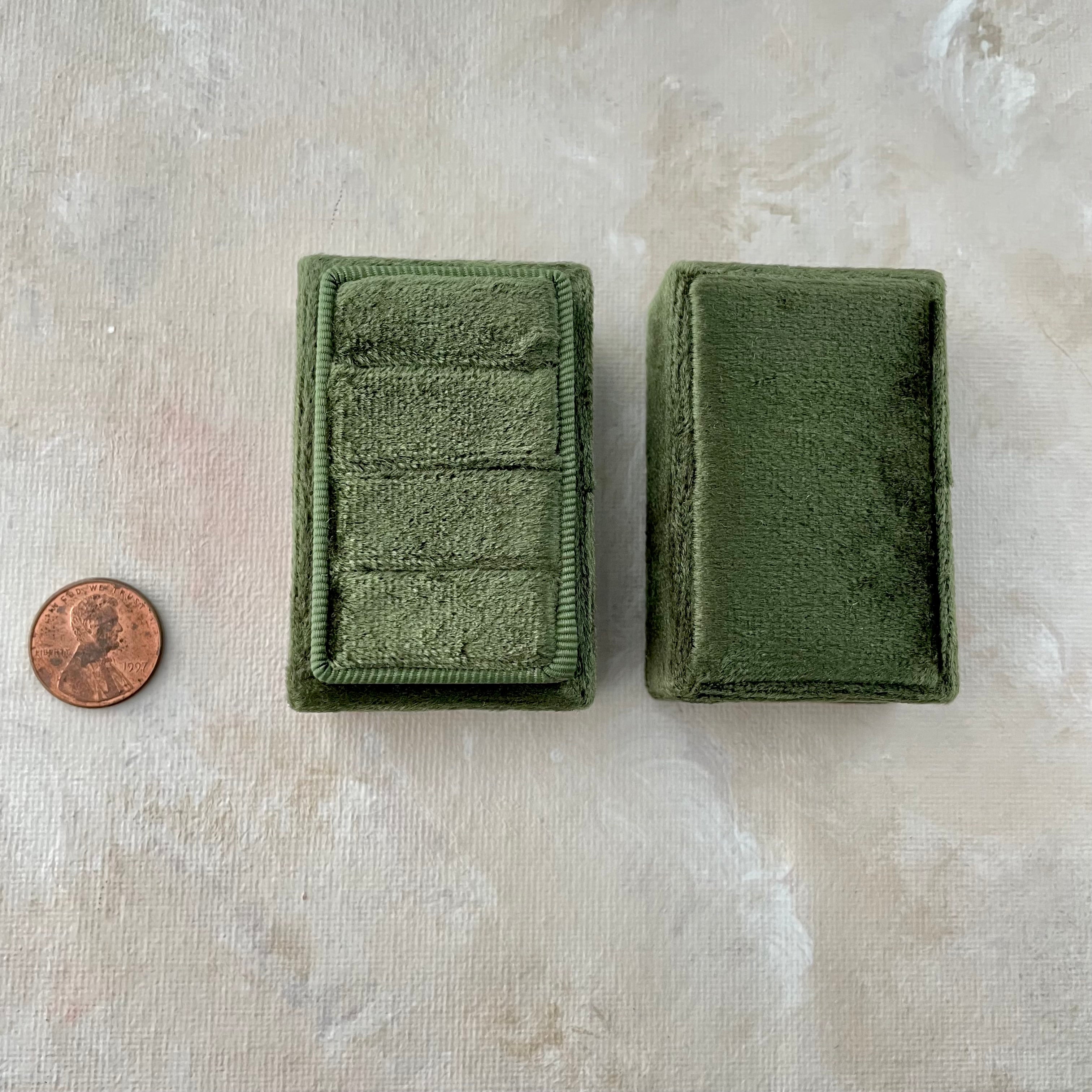 Olive Green tripe slot ring box with no rings and penny beside for size reference - Wedding Flat lay props from Champagne & GRIT