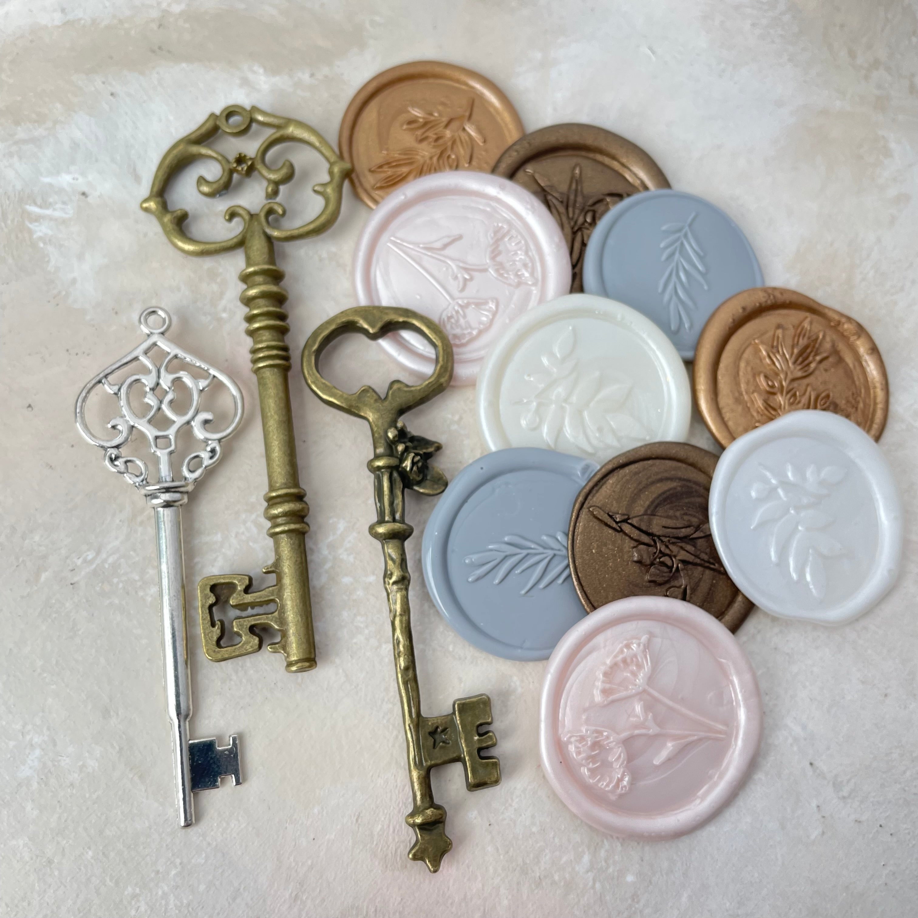 3 keys, gold, bronze and silver and 10 classic wax seals - Wedding Flat lay props from Champagne & GRIT