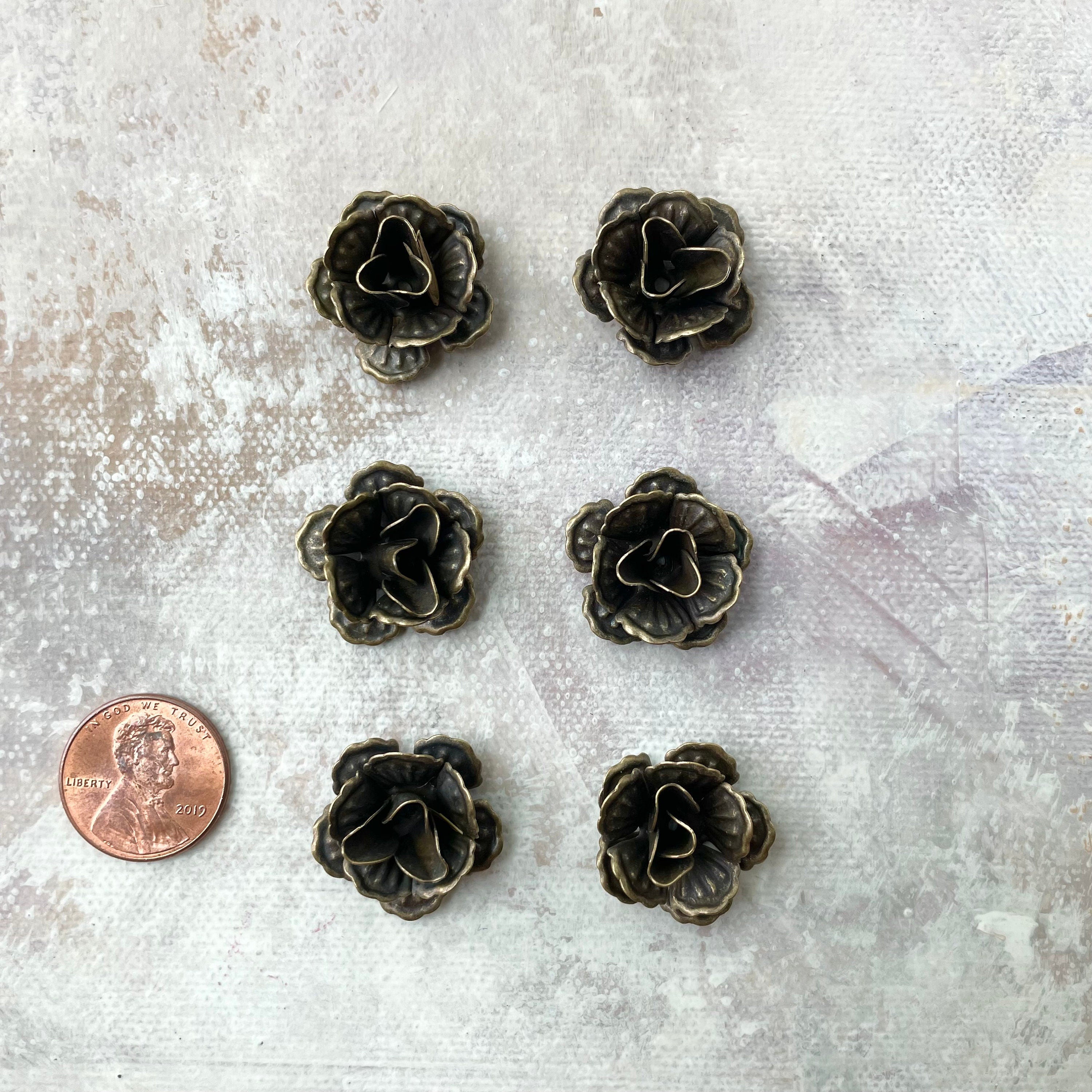 6 mini bronze styling flowers with penny beside for size reference - Flat lay props from Champagne & GRIT