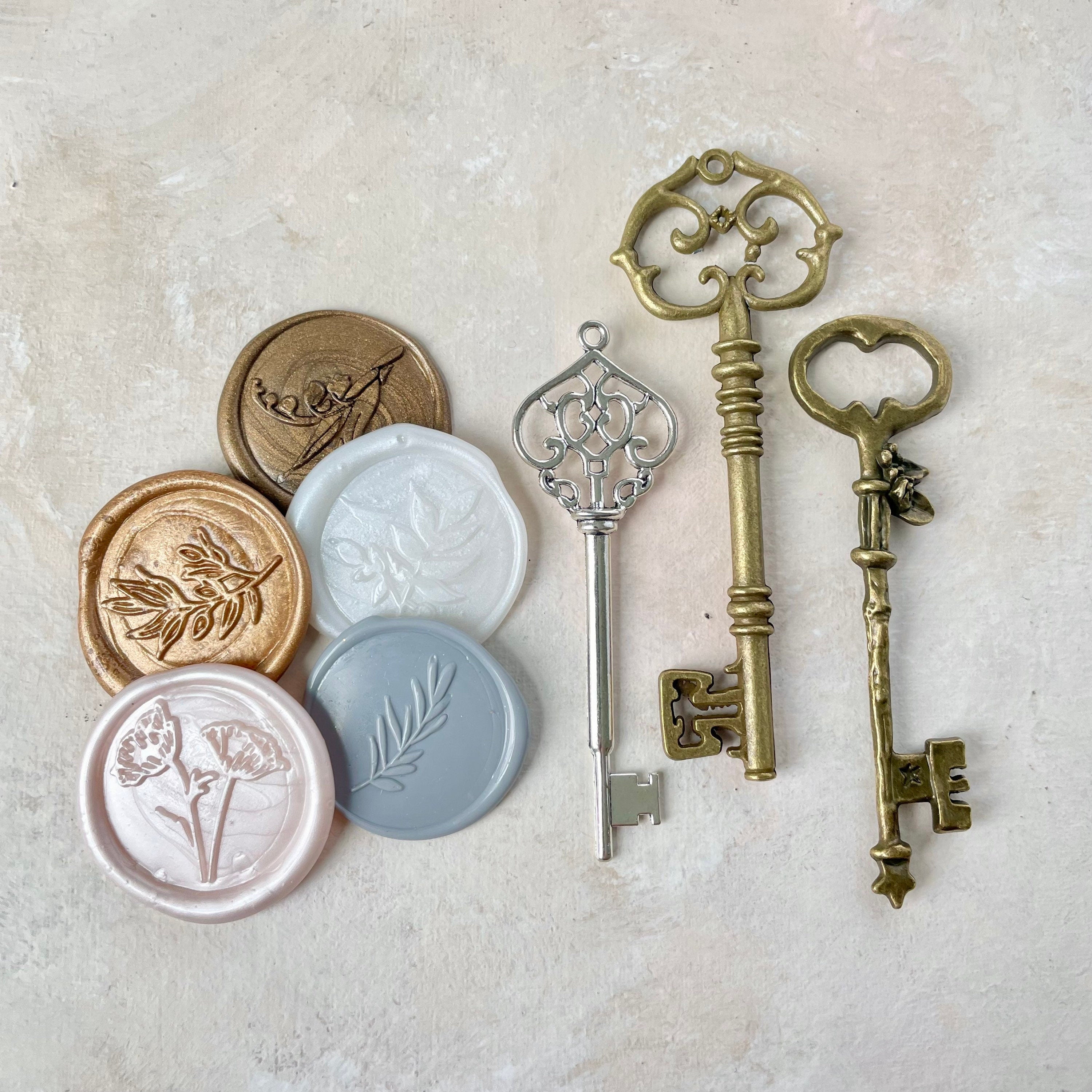 5 Classic Wax Seals, neutral color styled beside three vintage keys - flat lay props from Champagne & GRIT
