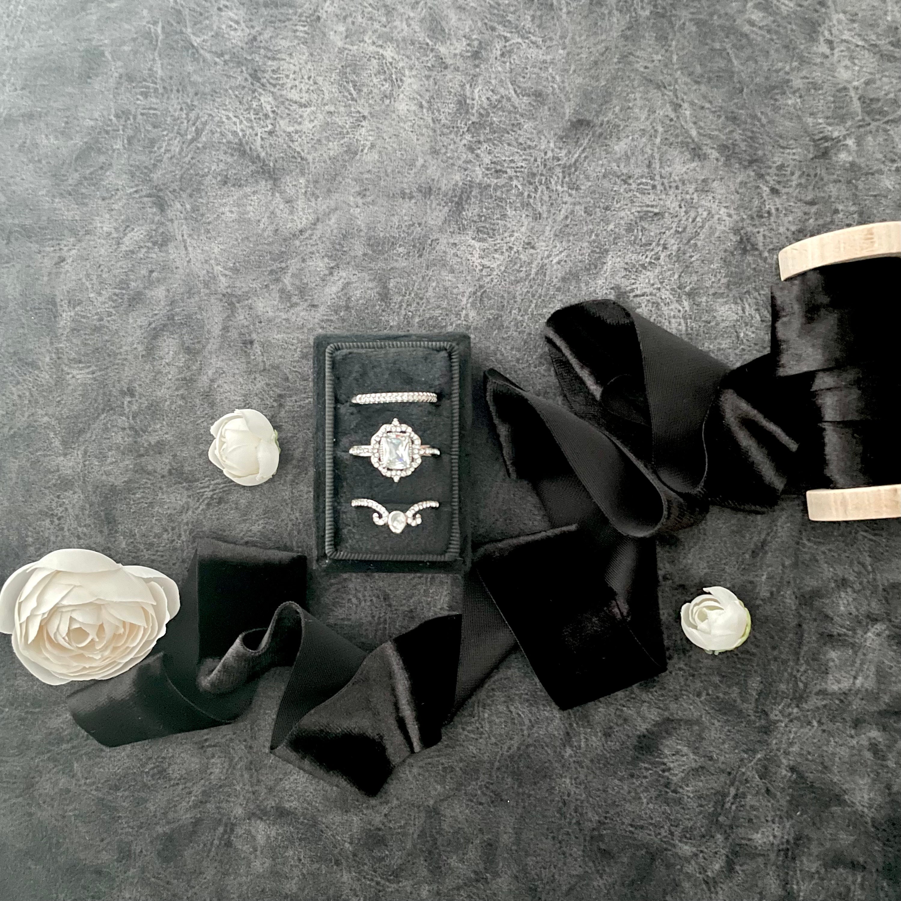 Black triple ring box styled with modern black velvet ribbon - Flat Lay Props from Champagne & GRIT