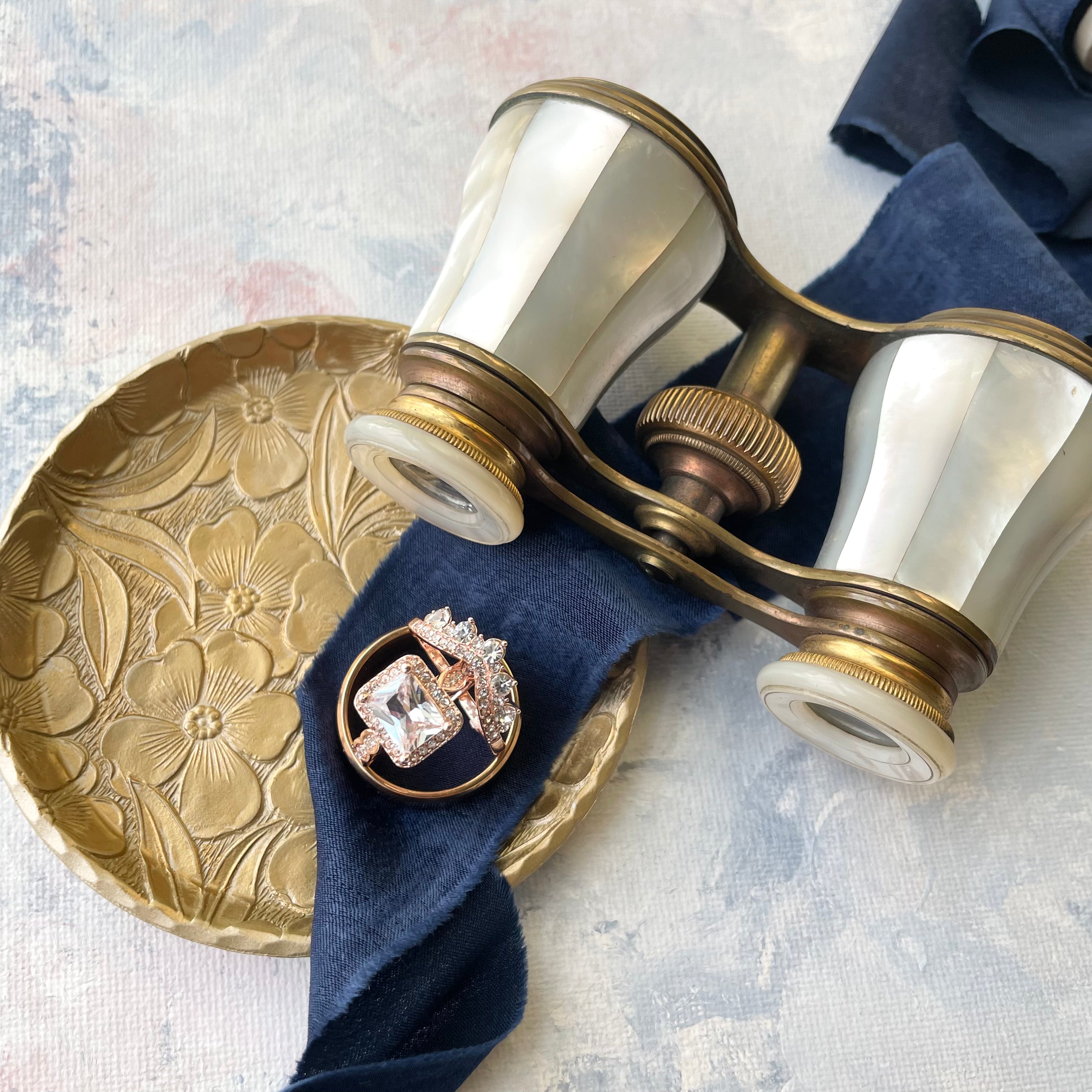 Painted Gold DOGWOOD Dish, ornate gold tray, styled with navy blue ribbon and vintage opera glasses  - wedding flat lay props from Champagne & GRIT
