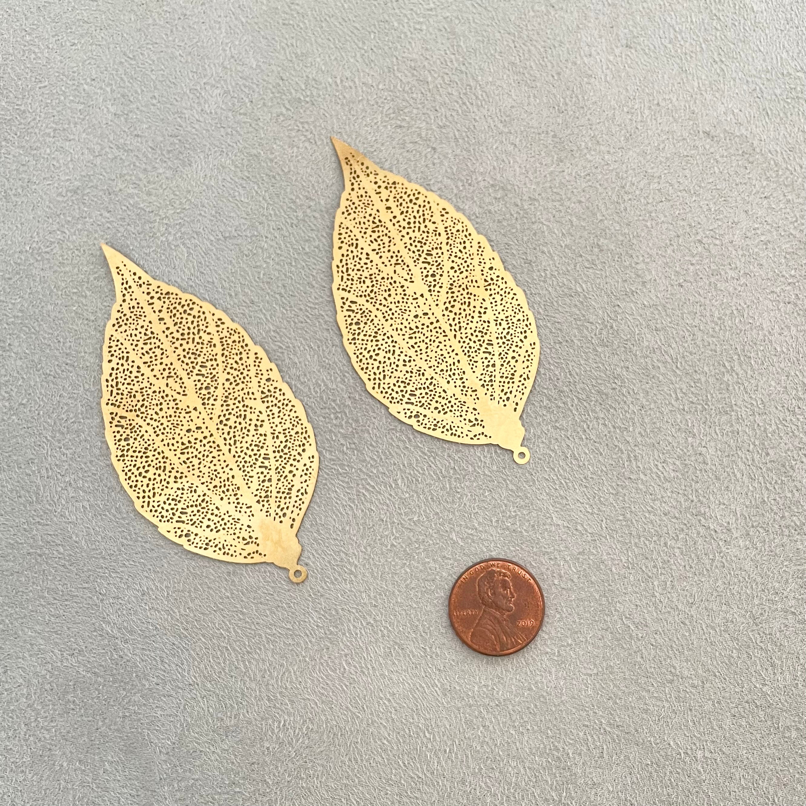 2 gold styling leaves, penny beside for size reference - flat lay props from Champagne & GRIT