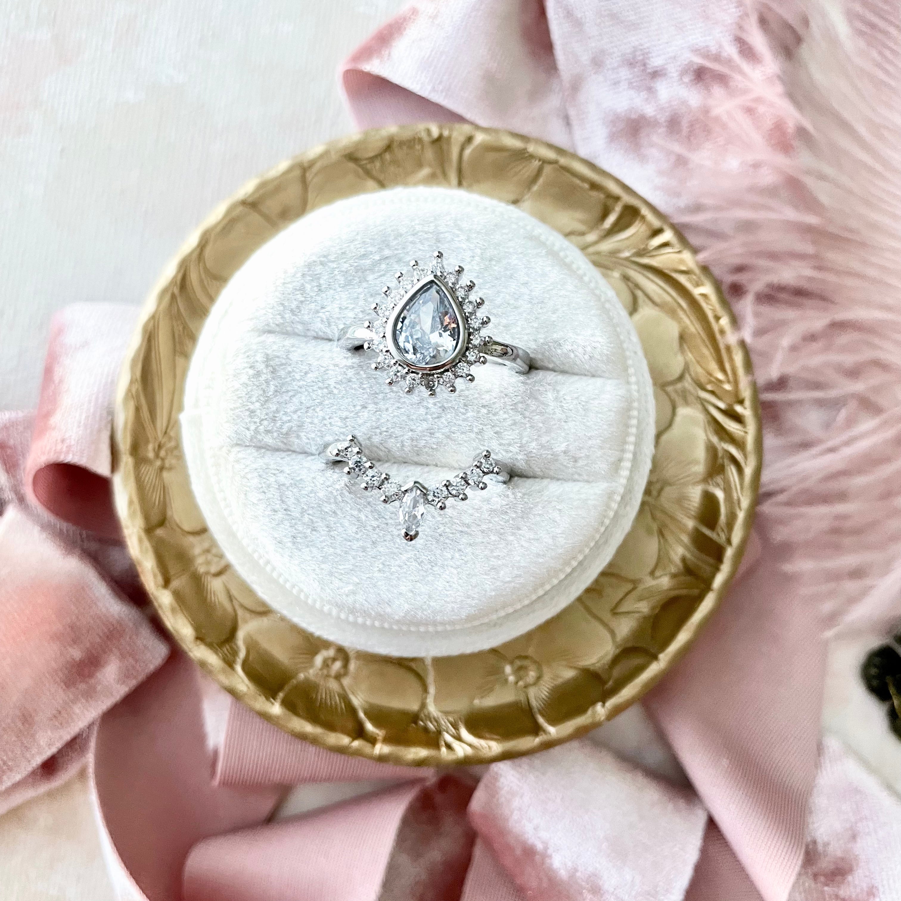 Round ivory ring box on round gold vintage dish styled with dusty pink ribbon - Wedding Flat lay props from Champagne & GRIT