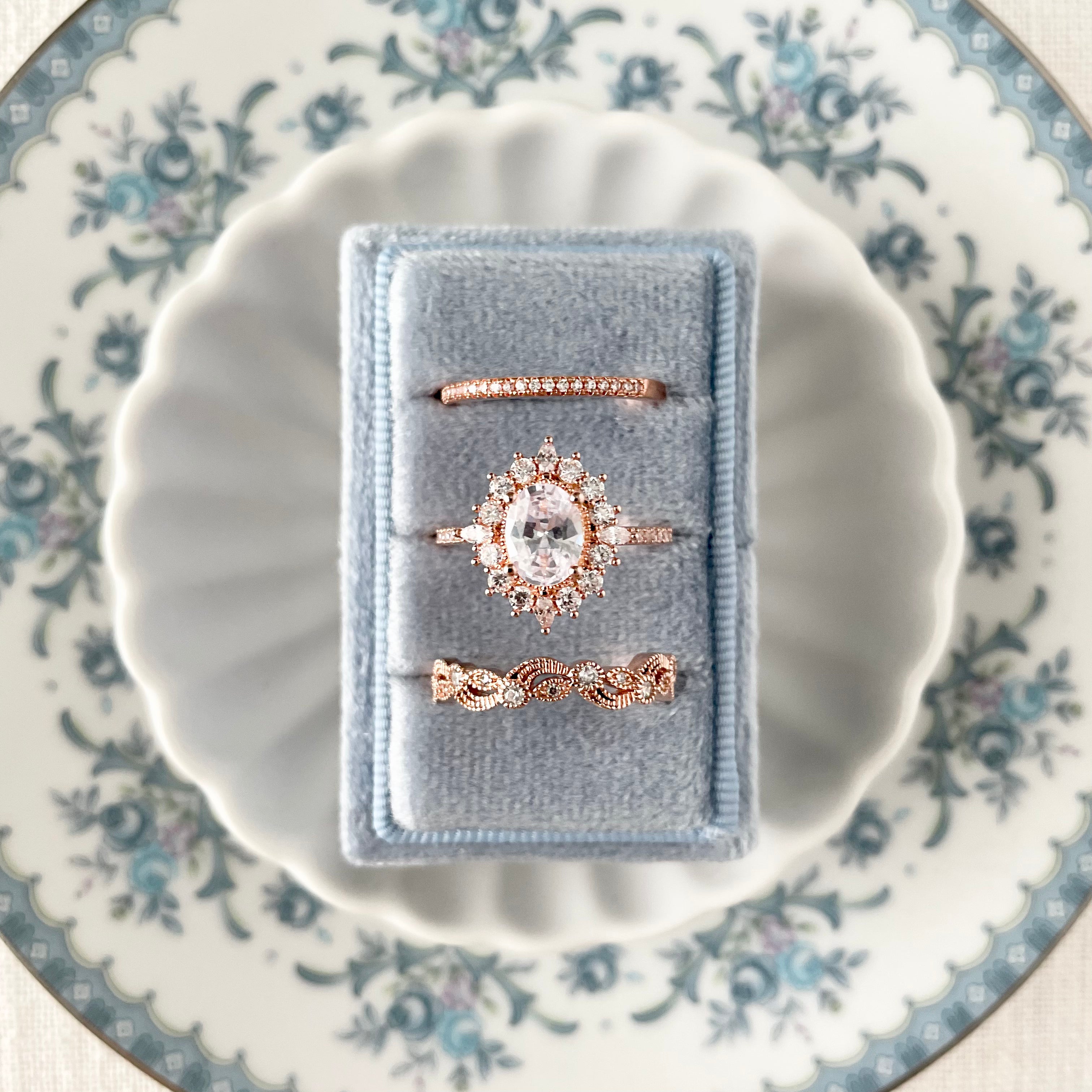 Close up of Dusty Blue 3 slot ring box on white dish - Wedding Flat lay props from Champagne & GRIT