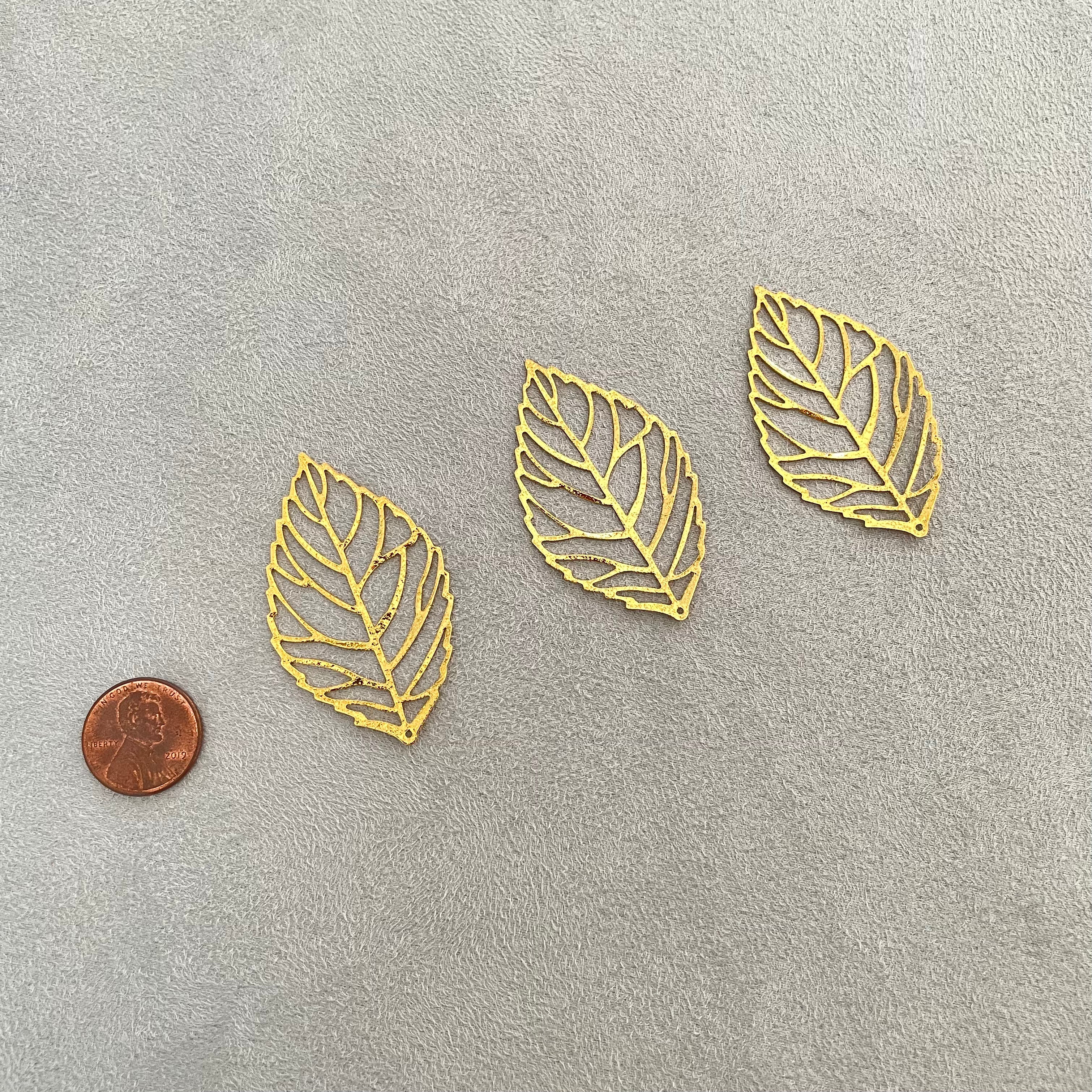 3 gold styling leaves,, penny beside for size reference  - flat lay props from Champagne & GRIT