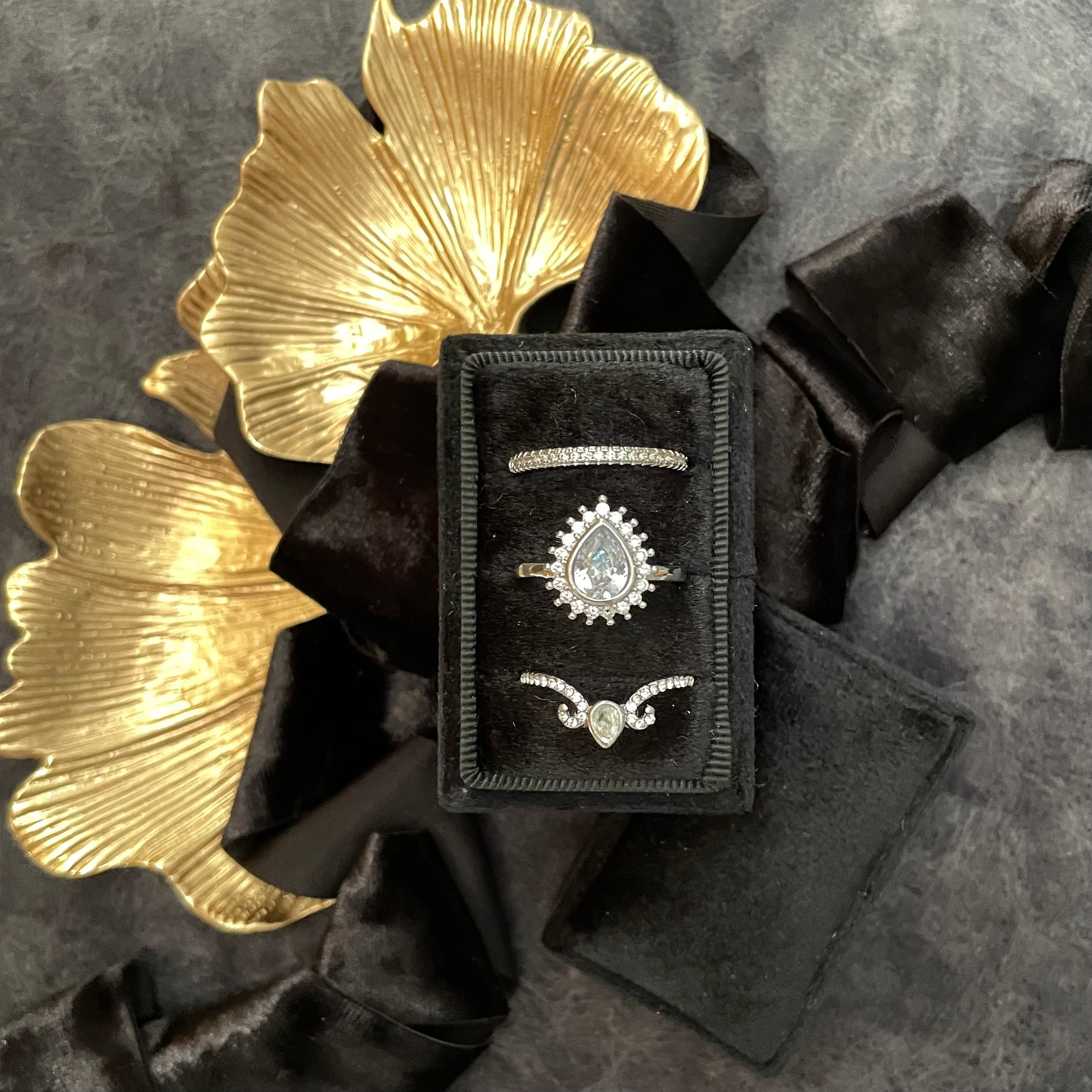 Black triple ring box styled with black flat lay ribbon and Ginkgo Leaf Gold Styling Tray - Flat Lay Props from Champagne & GRIT