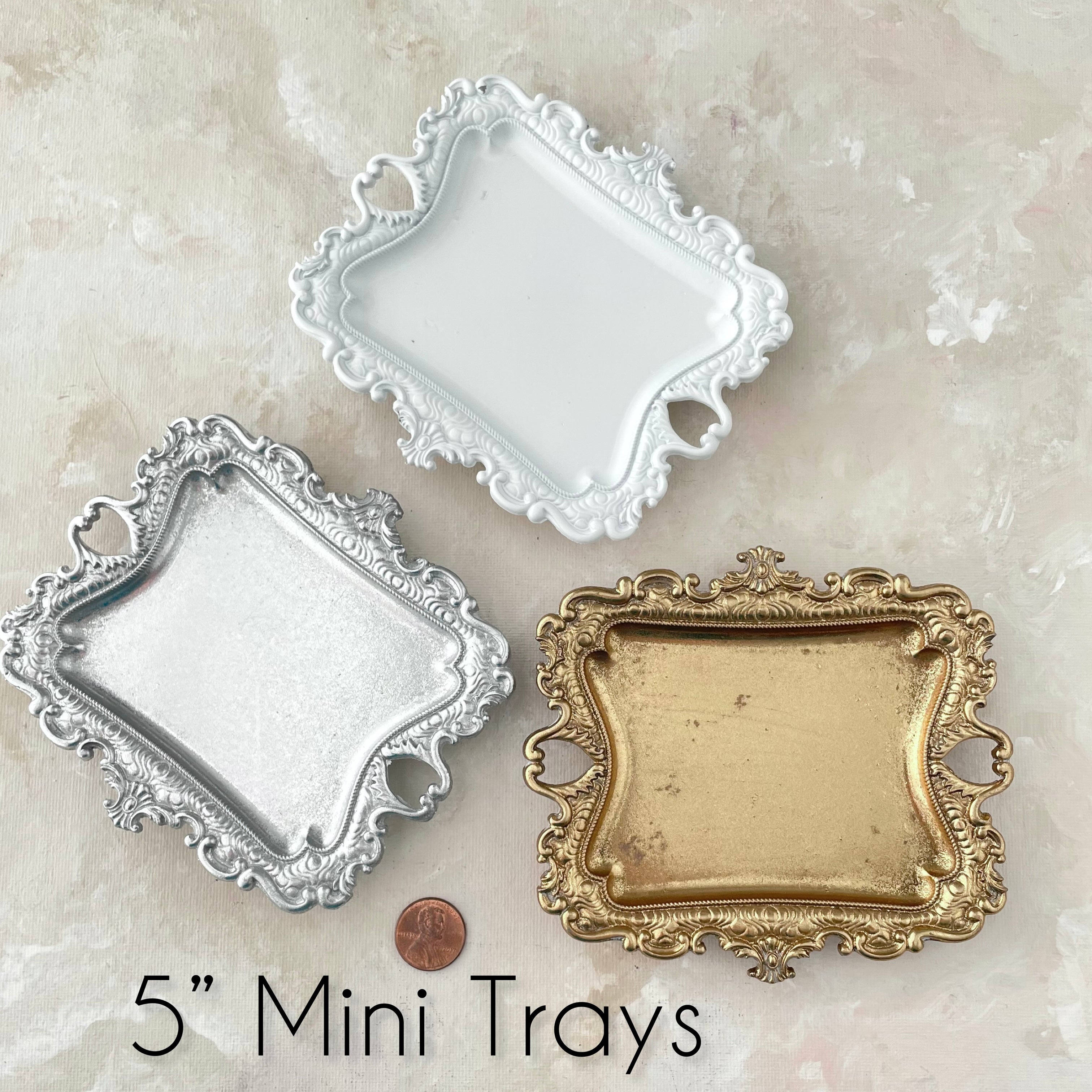 Vintage gold tray, silver tray, and white tray, penny beside for size reference - Wedding Flat Lay Props from Champagne & GRIT